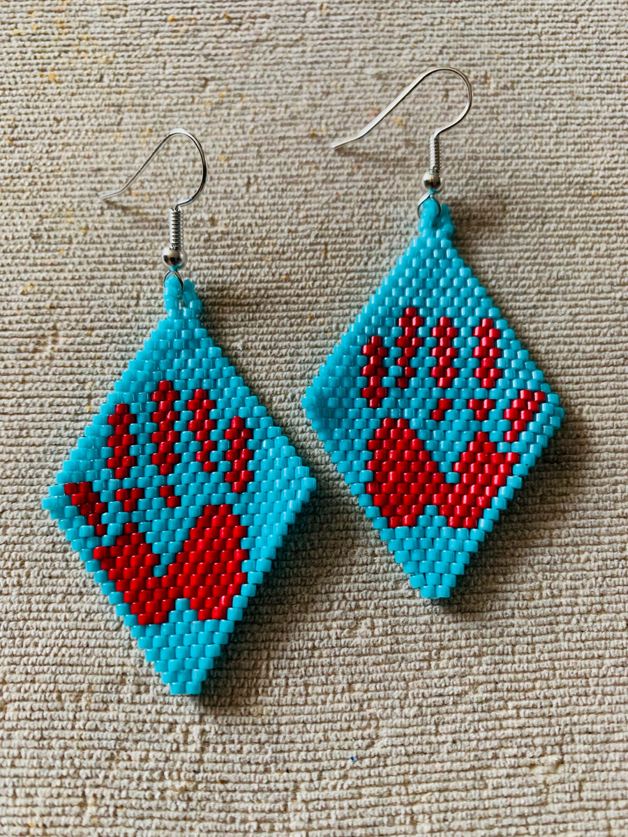 Hand deals beaded earrings